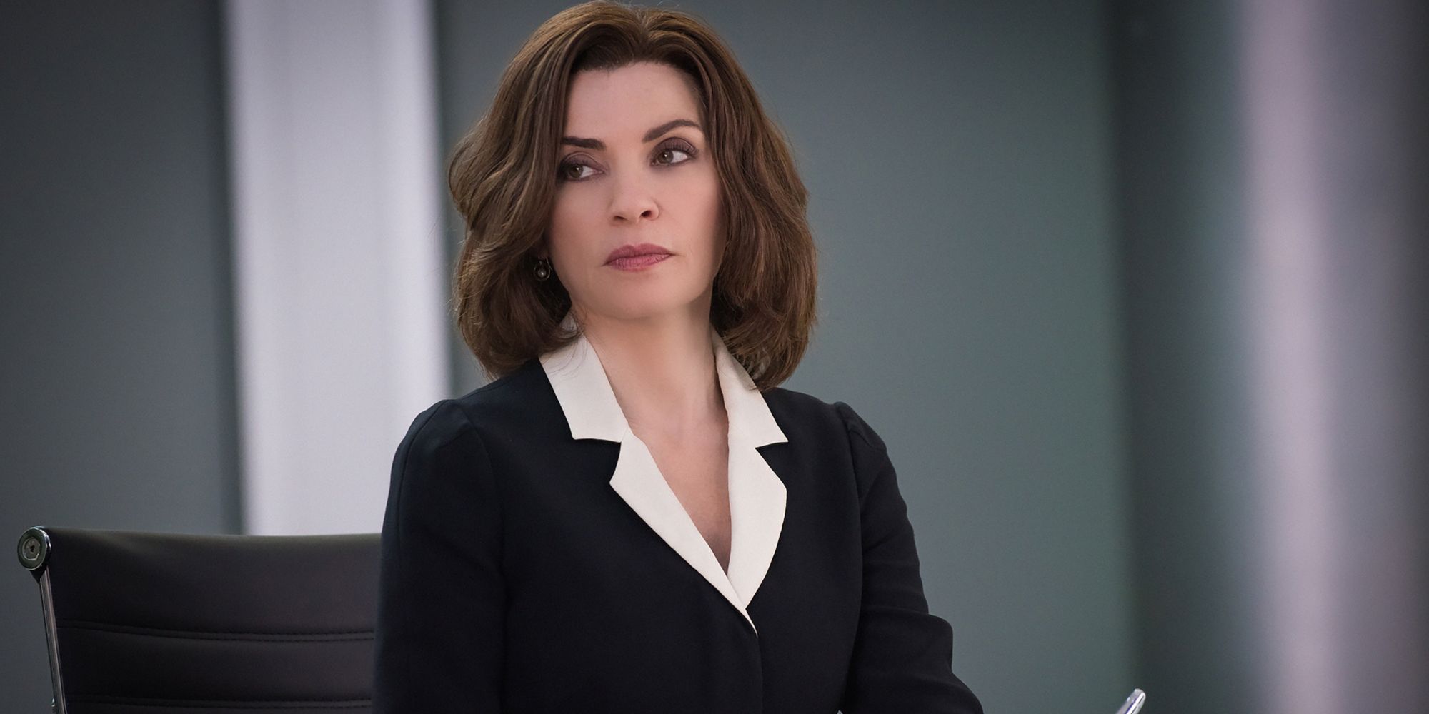 Julianna Margulies sits in a meeting room in The Good Wife
