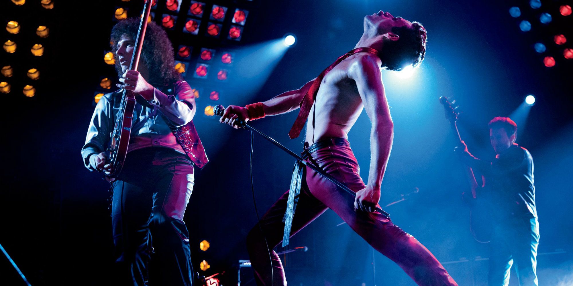 Freddie Mercury theatrically performing onstage with Queen in Bohemian Rhapsody