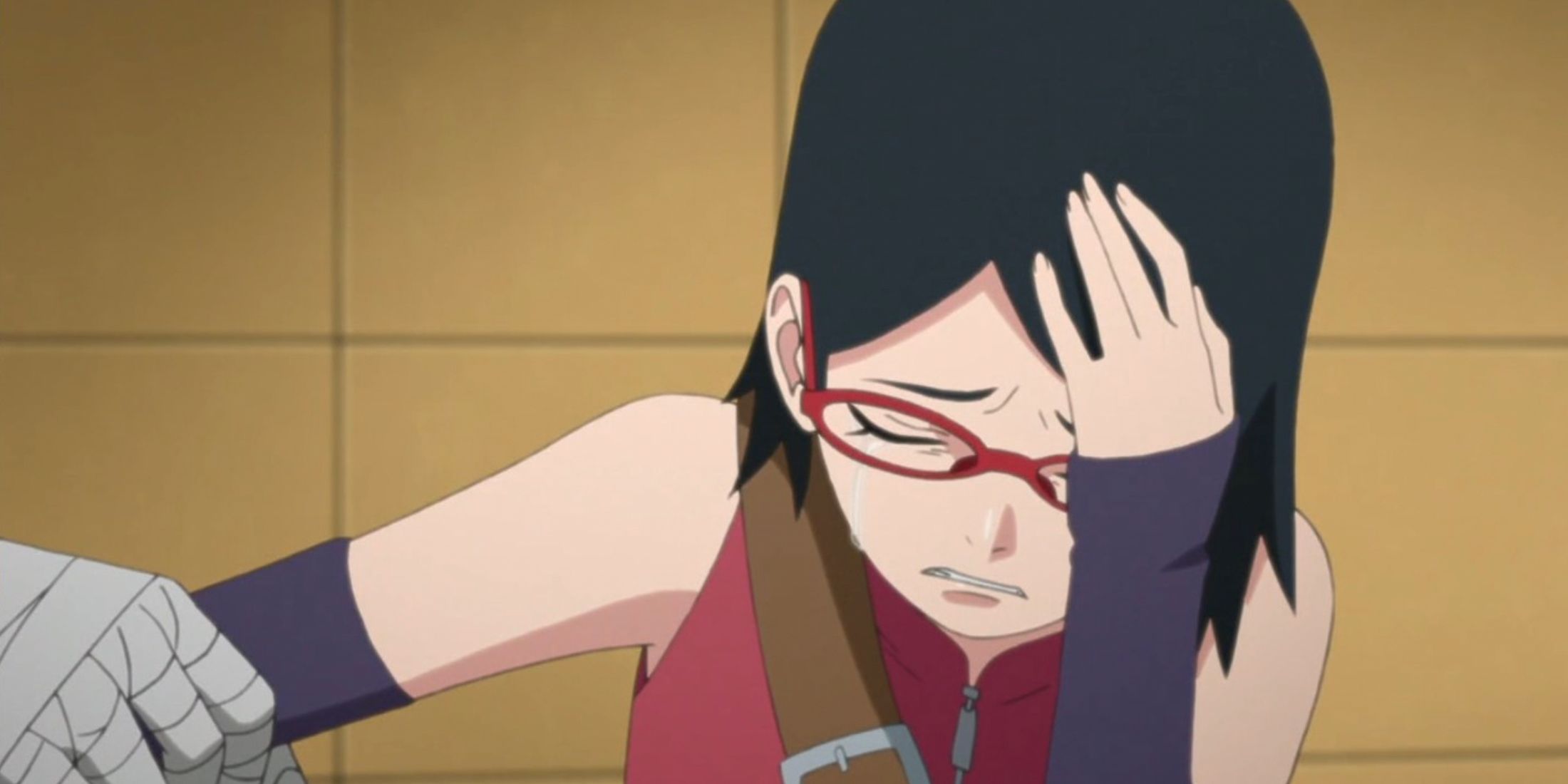 Sarada cries with her hand to her head in Boruto