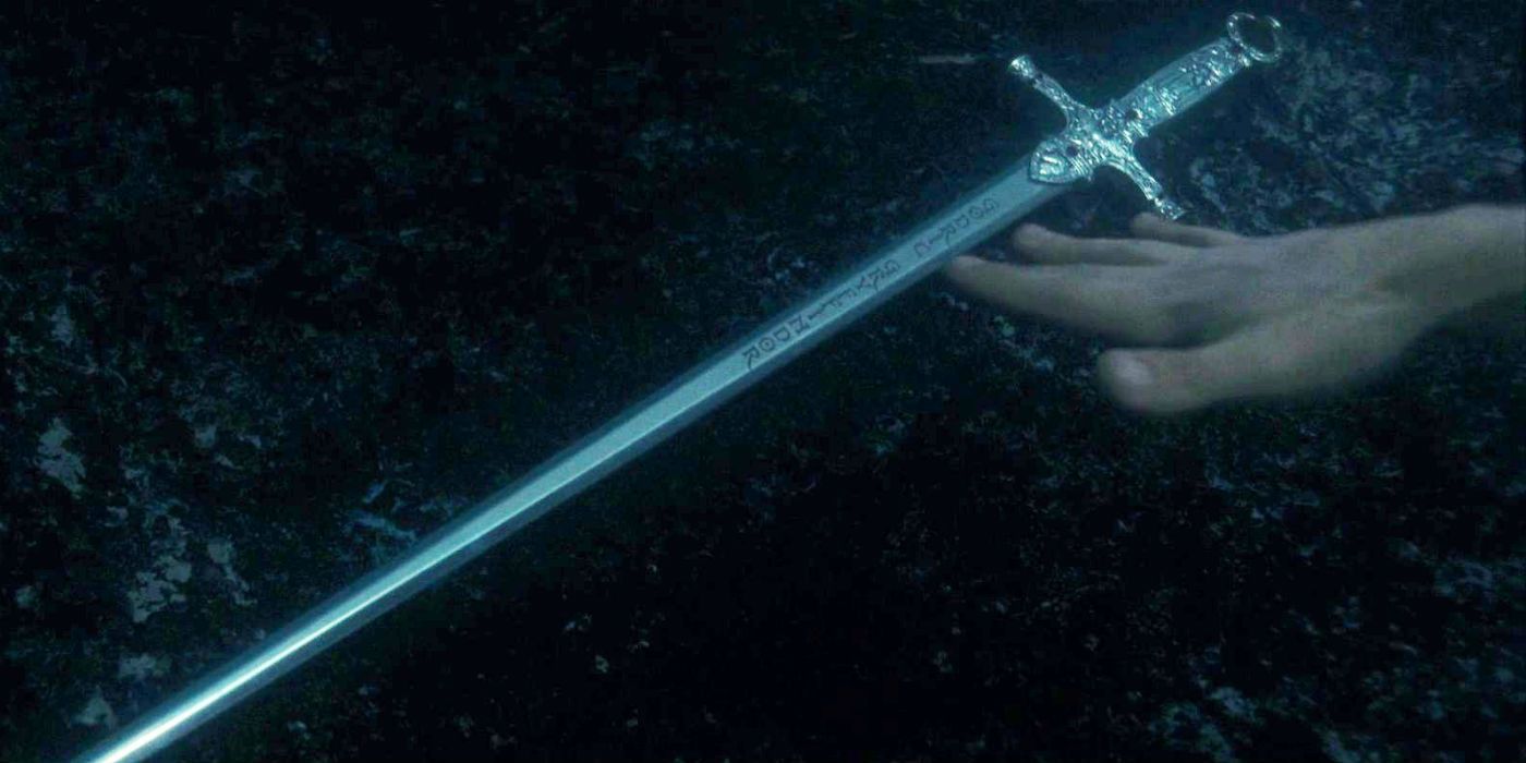 Harry reaching for the sword of Gryffindor in the frozen lake