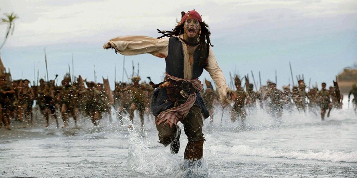 Johnny Depp's Jack Sparrow running from an army in The Pirates of the Caribbean