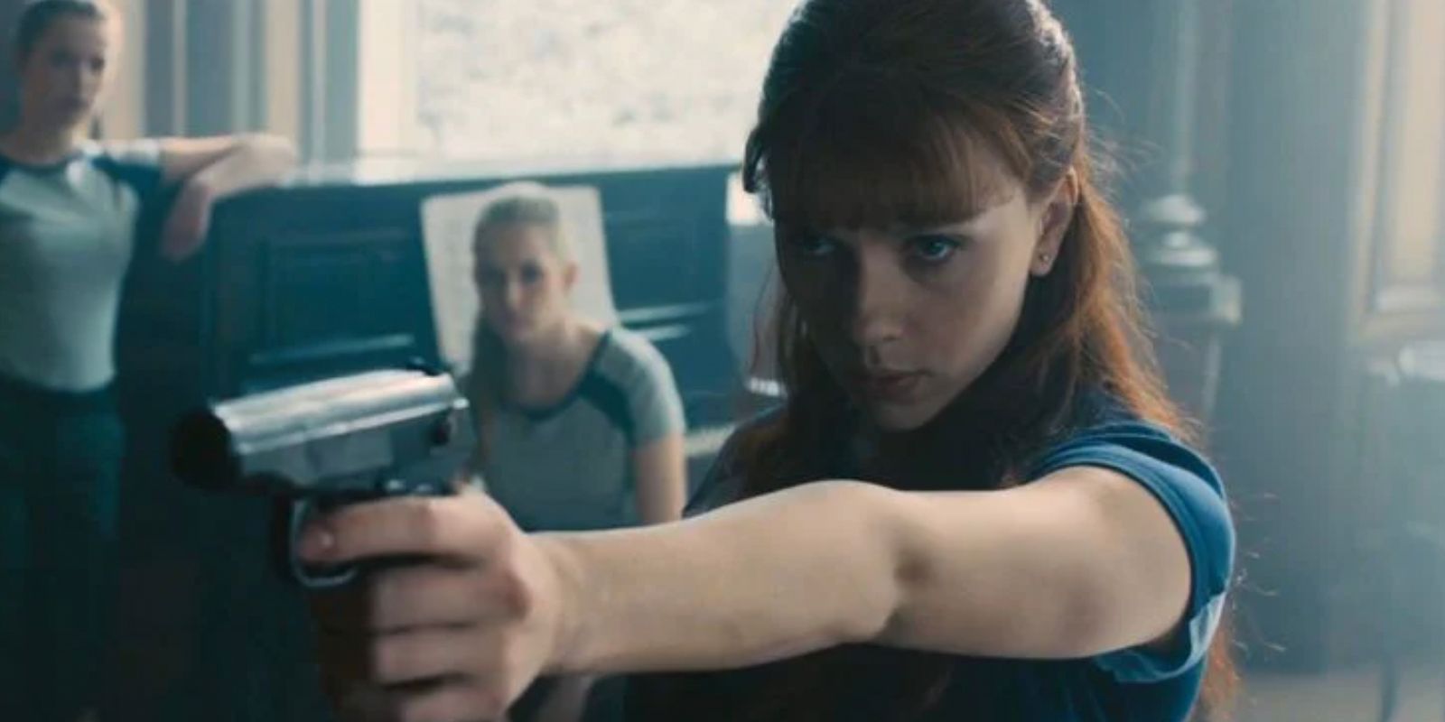 A young Natasha Romanoff takes aim in a Red Room training session flashback in Avengers Age Of Ultron