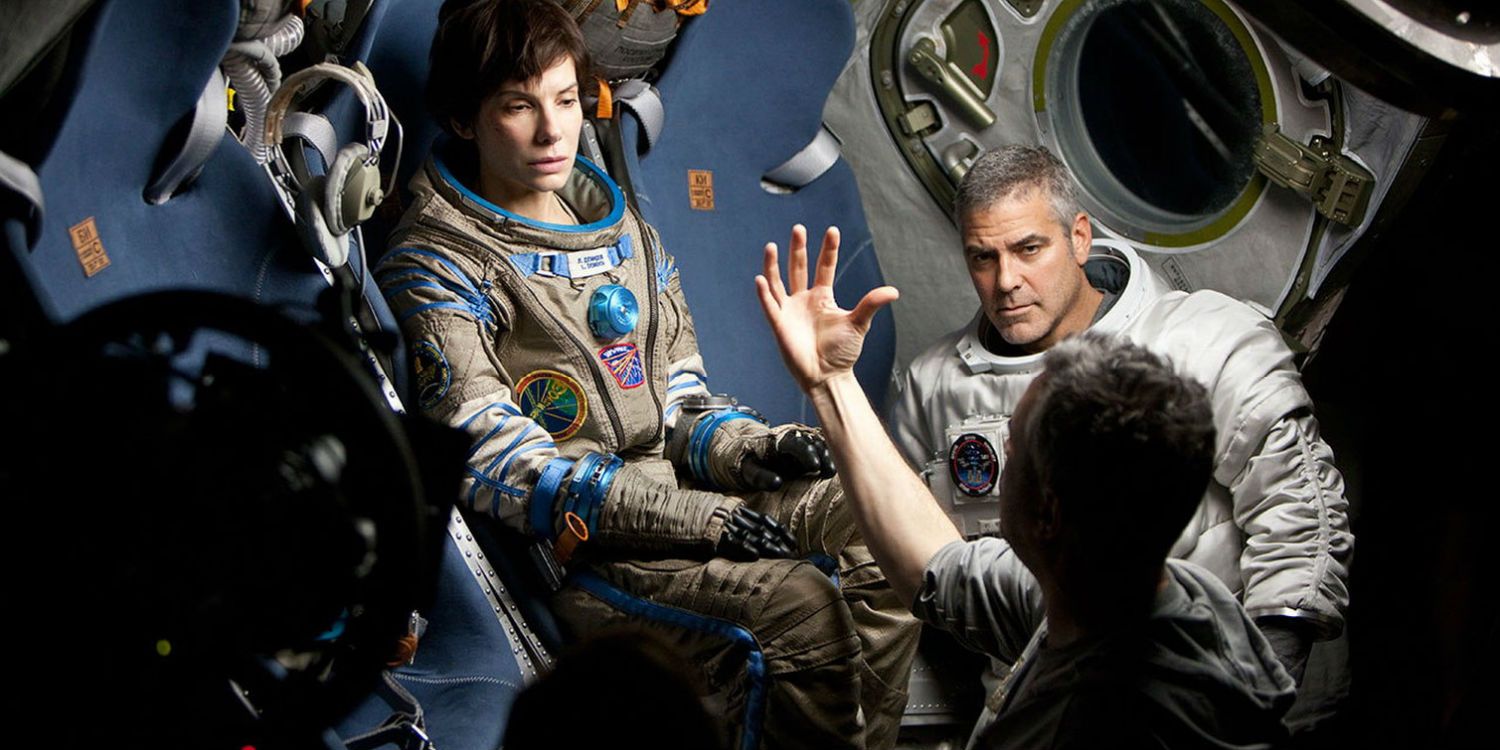 Gravity set photo - Sandra Bullock George Clooney Alfonso Cuaron