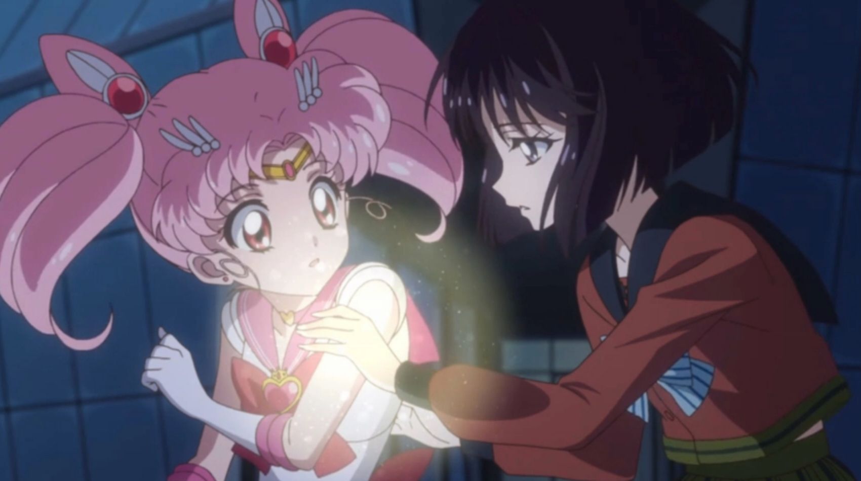 Hotaru heals Chibiusa after a fight in Sailor Moon Crystal