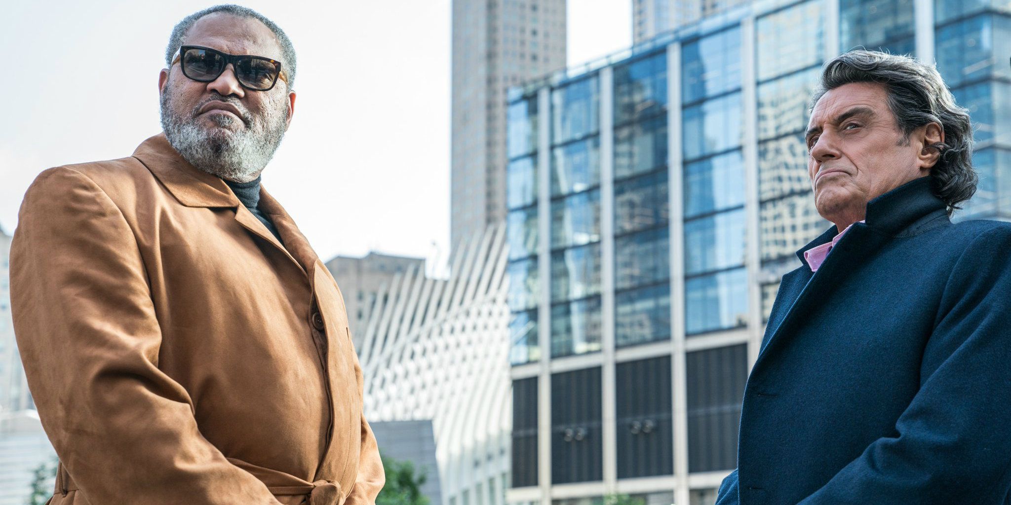 Laurence Fishburne and Ian McShane on a rooftop in John Wick 3