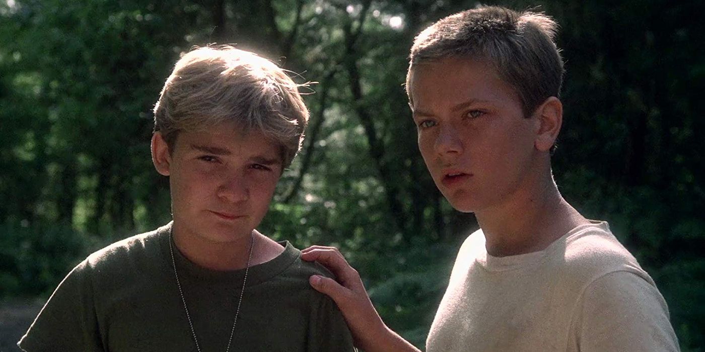 Chris and Teddy standing side by side in Stand by Me