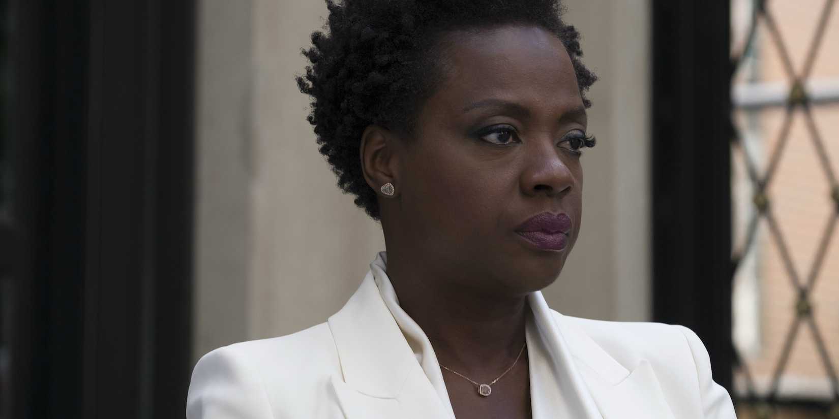 Veronica (Viola Davis) wearing a white suit and looking serious in Widows