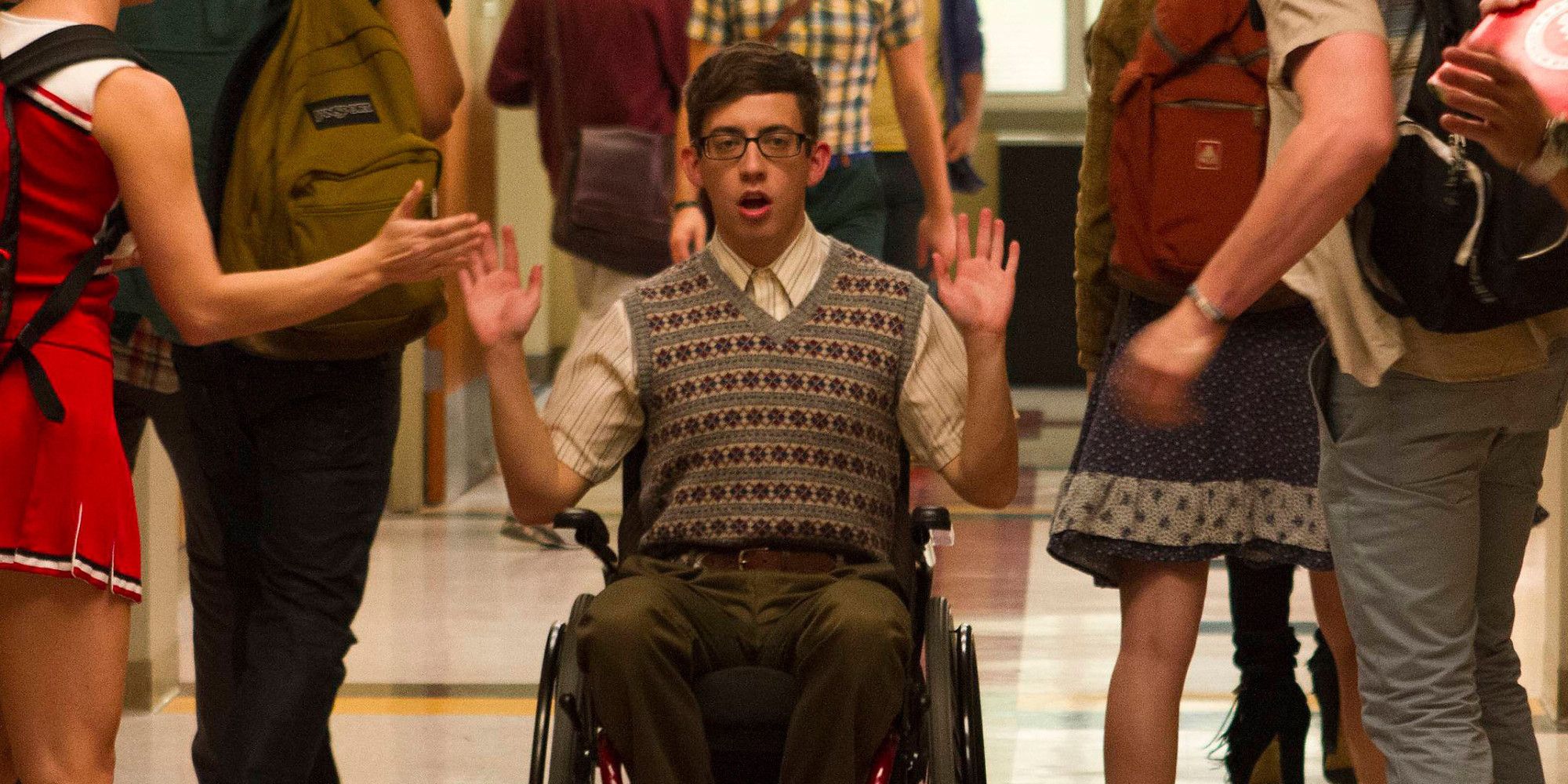 Kevin McHale in Glee wheeling down hallway
