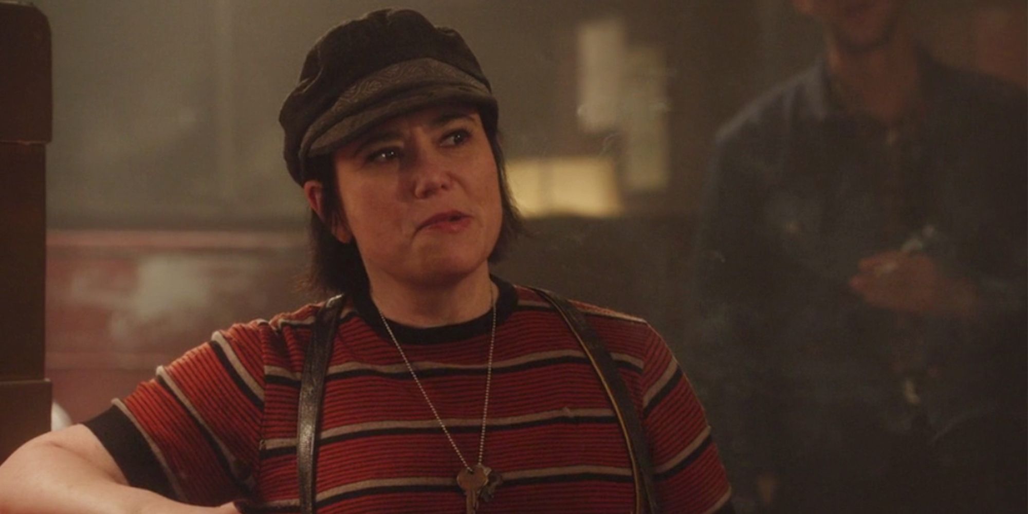 Alex Borstein as Susie Myerson, chewing on her lip and looking off-screen in Marvelous Mrs. Maisel