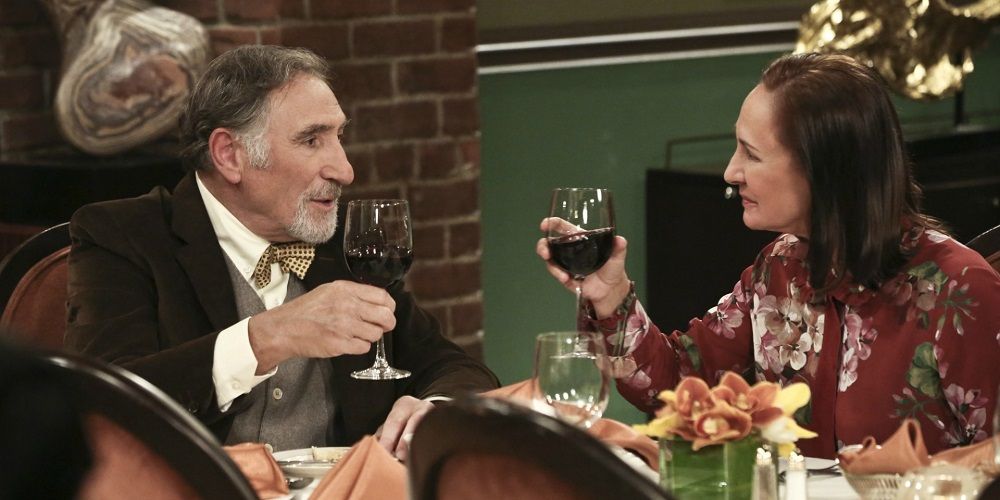 Alfred Hofstadter and Mary Cooper toasting in The Big Bang Theory.