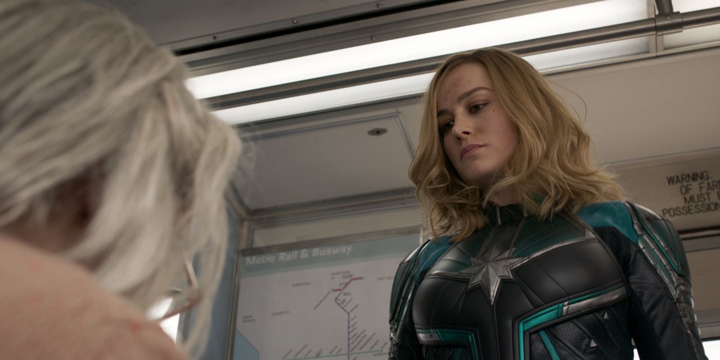 Brie Larson as Captain Marvel on train with Old Woman