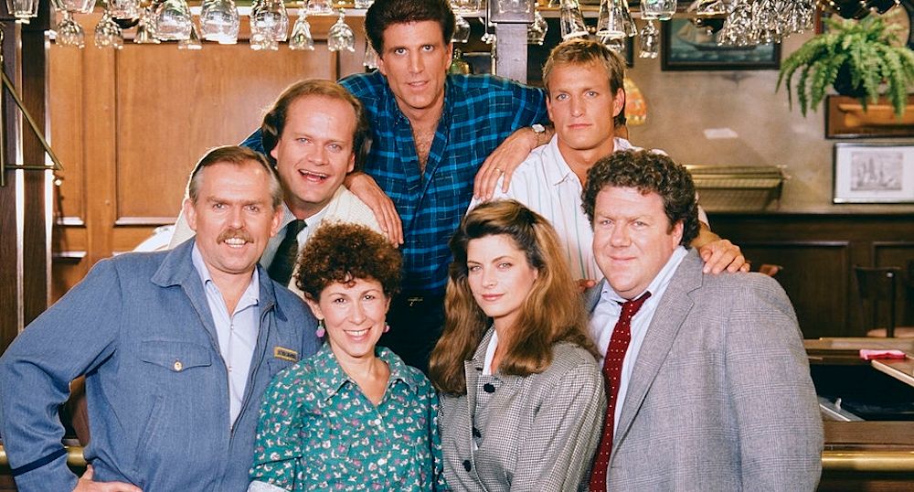The Cheers cast posing for a photo.