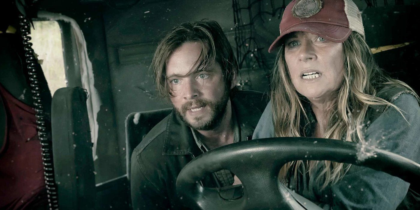 Sarah drives a truck with a a man sitting behind her in Fear The Walking Dead.