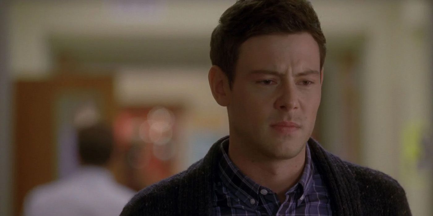 Finn looking sad while on the McKinley hallway in Glee.