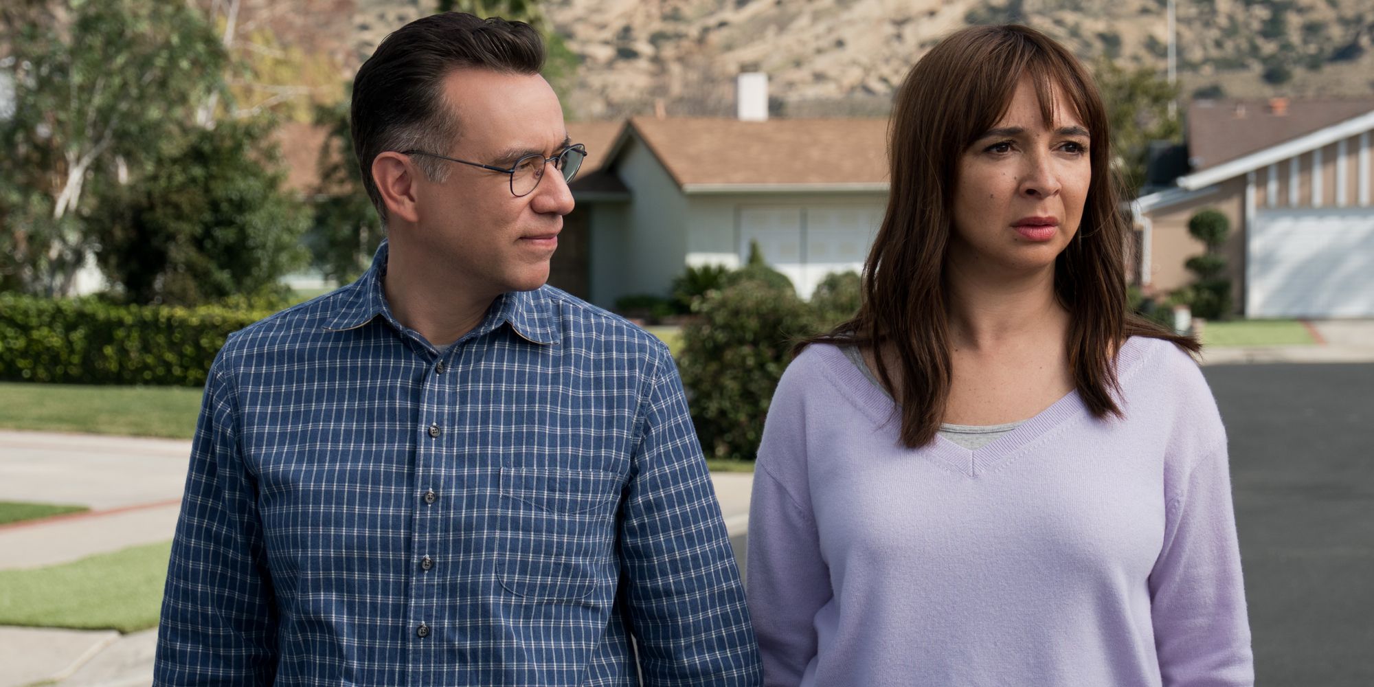 Fred Armisen and Maya Rudolph standing outside in the suburbs in Forever