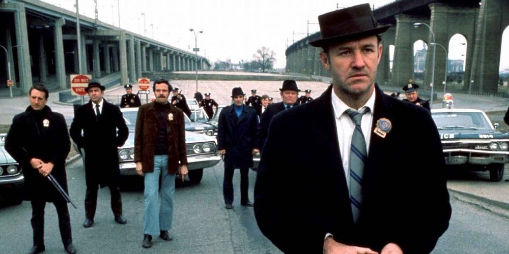 Gene Hackman and a bunch of cops/detectives with guns waiting for something in The French Connection