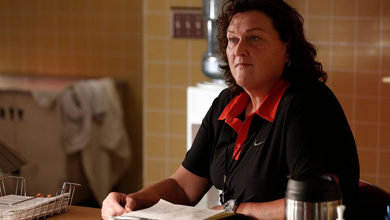 Coach Beiste sits at their desk in Glee