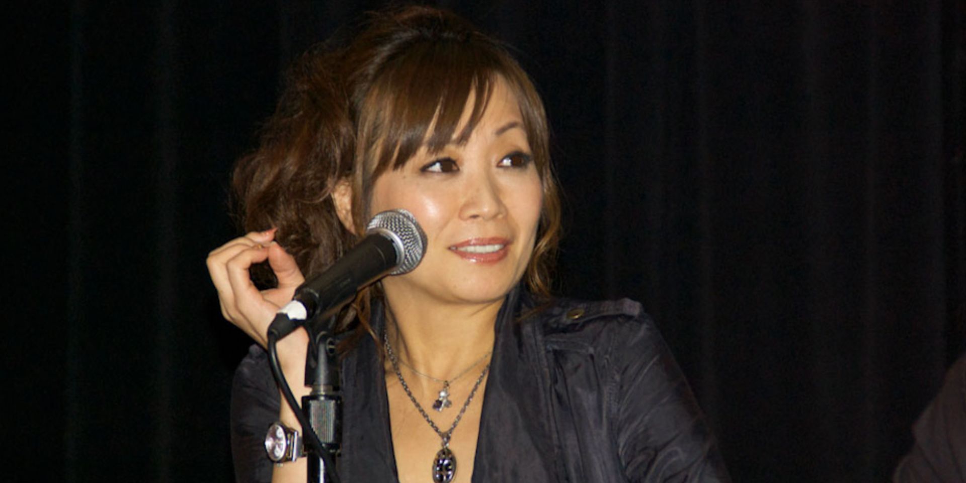 Junko Takeuchi speaks on a panel