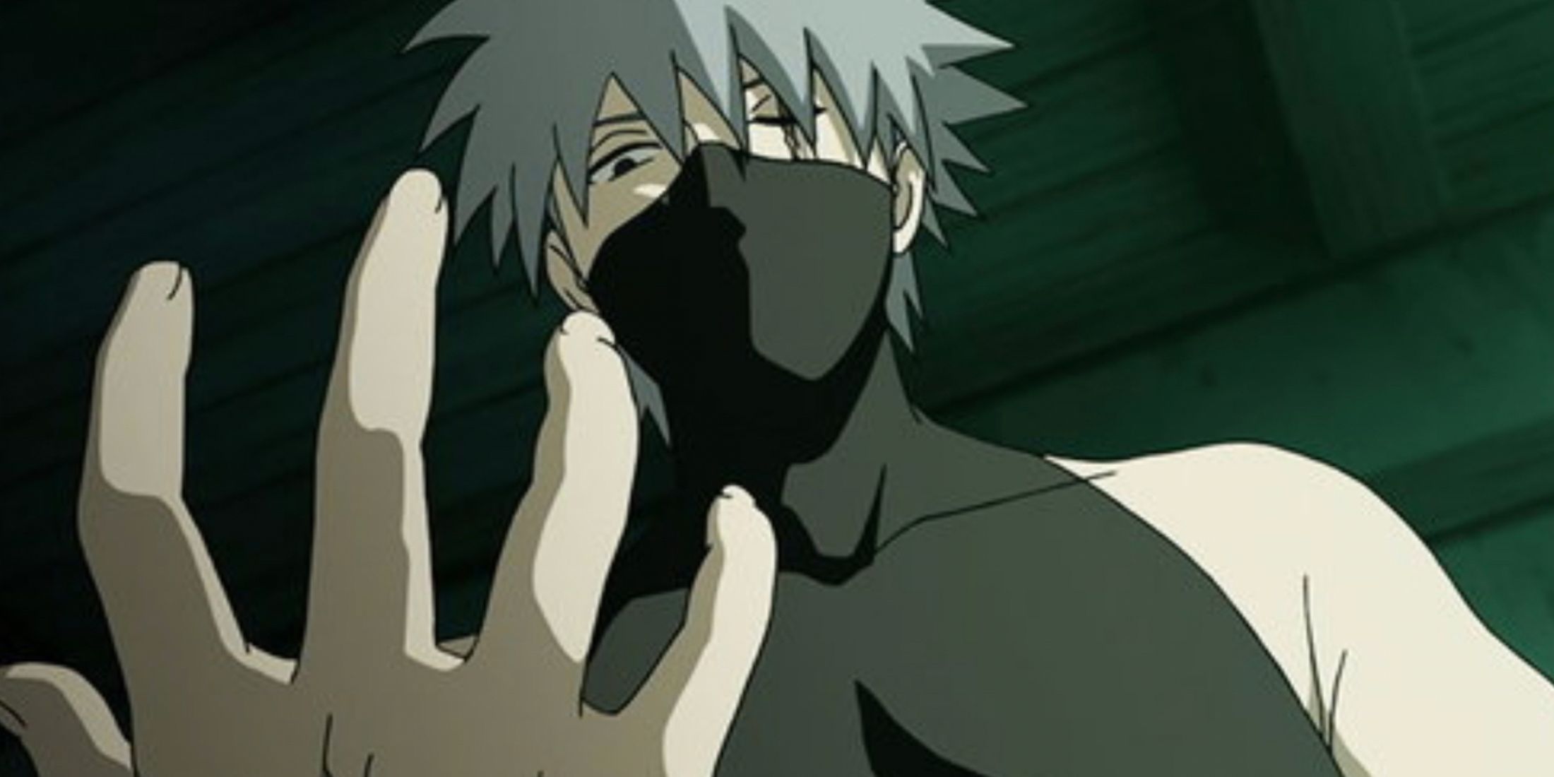 Kakashi looks down at his hand in Shadow Of The Black Anbu