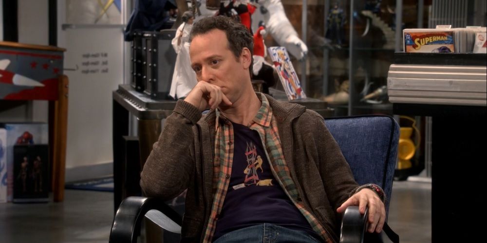 Kevin Sussman as Stuart Bloom sitting in the comic book store in The Big Bang Theory