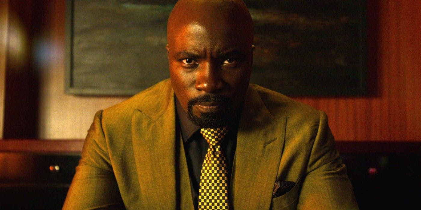 Luke Cage in a suit in his club 
