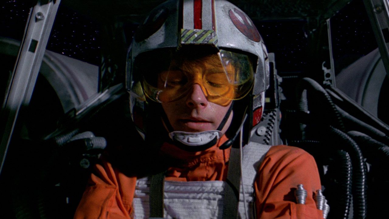 Luke in his X-wing in Star Wars with his eyes closed using the Force