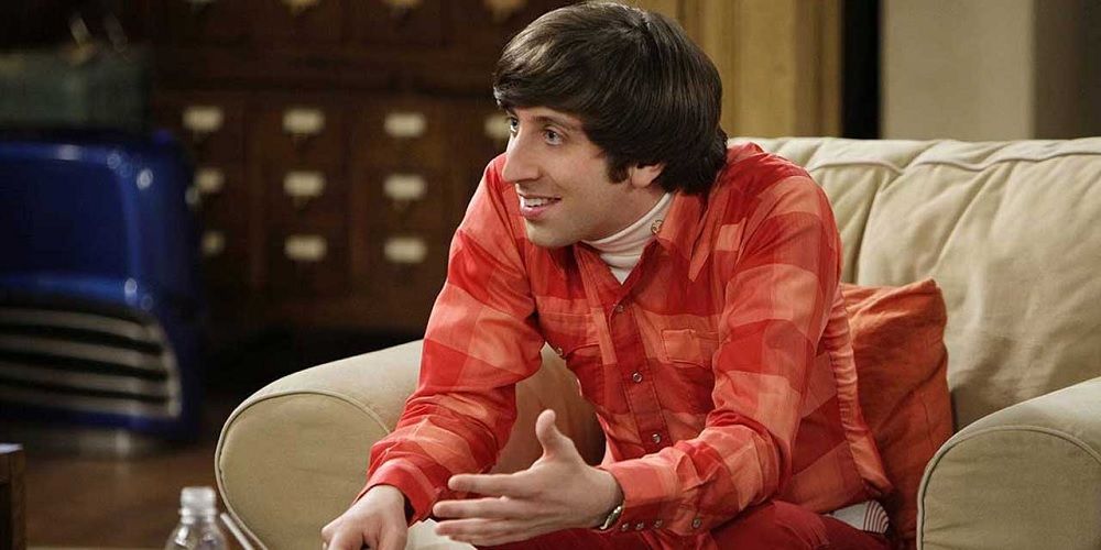 Howard Wolowitz talking while sitting on a couch in The Big Bang Theory