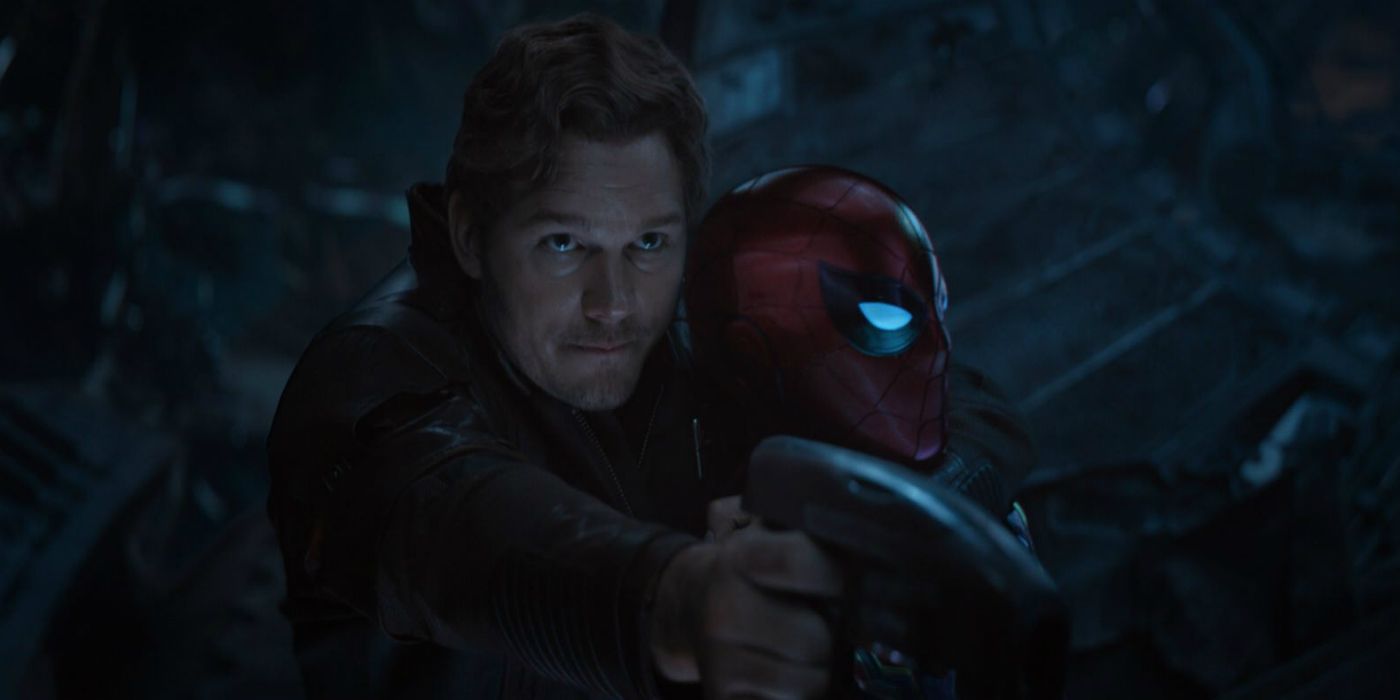 Peter Quill holding a weapon and holding Spider-Man in a headlock