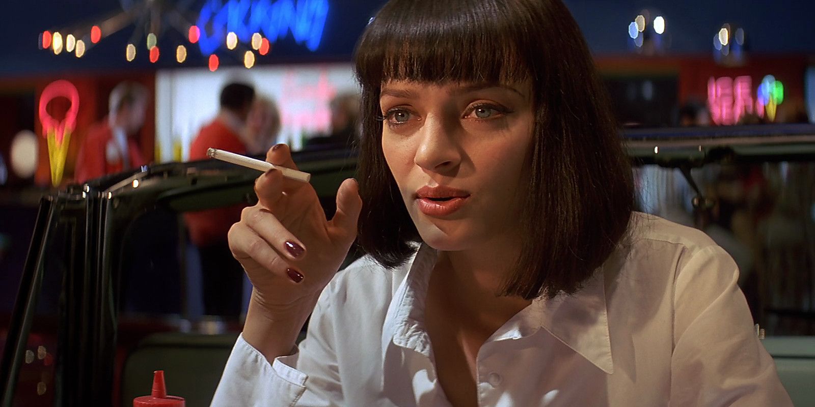 Mia Wallace smokes a cigarette in a restaurant in Pulp Fiction