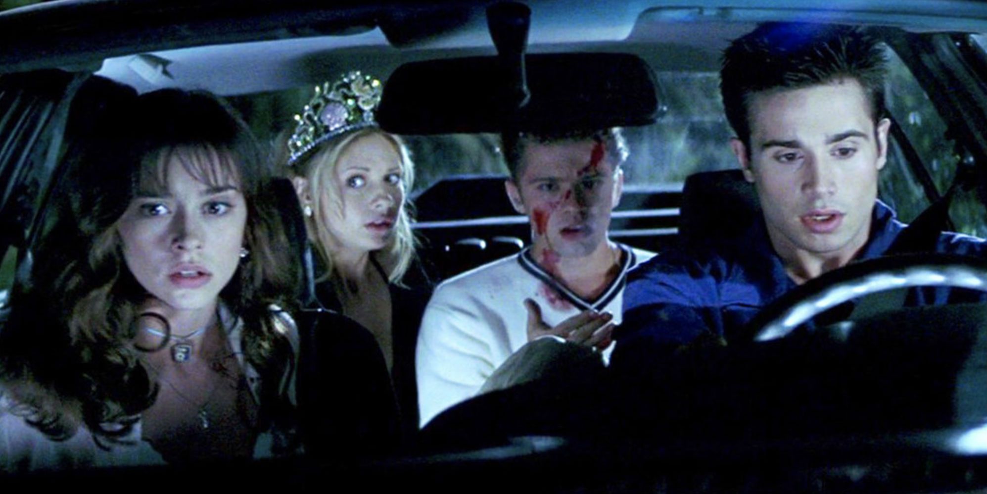 Four teenagers sit in a car in I Know What You Did Last Summer.