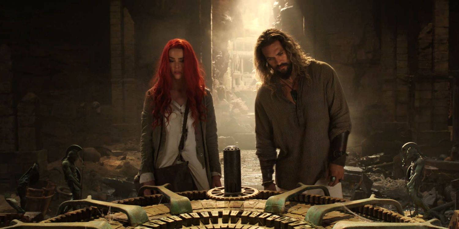 Aquaman and Mera standing in front of an ancient lock