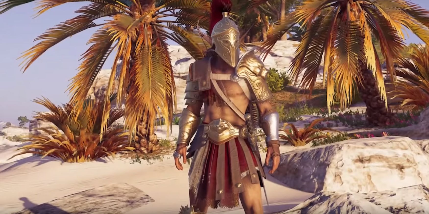 Aleksios standing on a beach and looking to the distance in Assassin's Creed Odyssey.