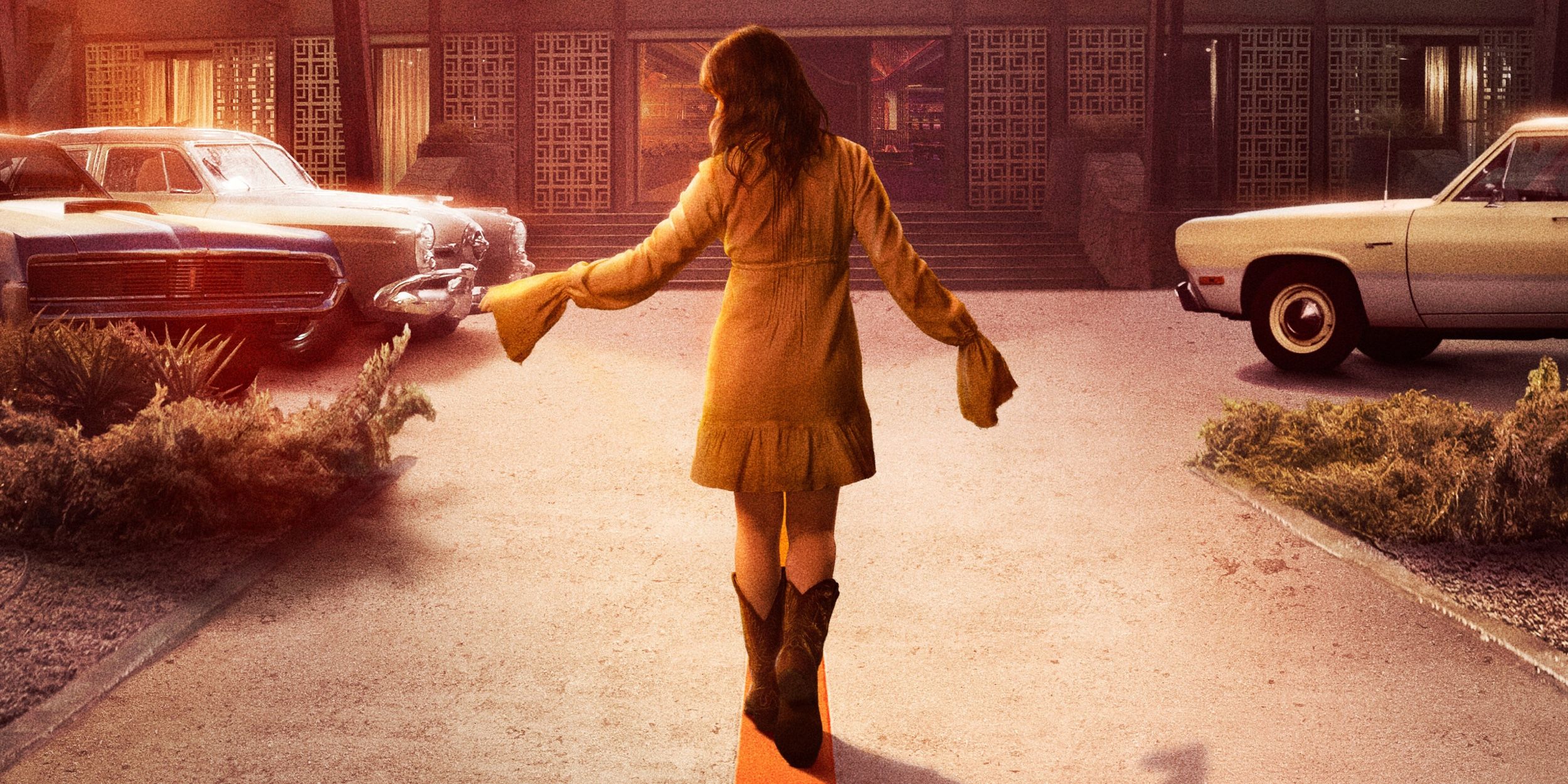 Rose standing in the middle of a parking lot in Bad Times at the El Royale