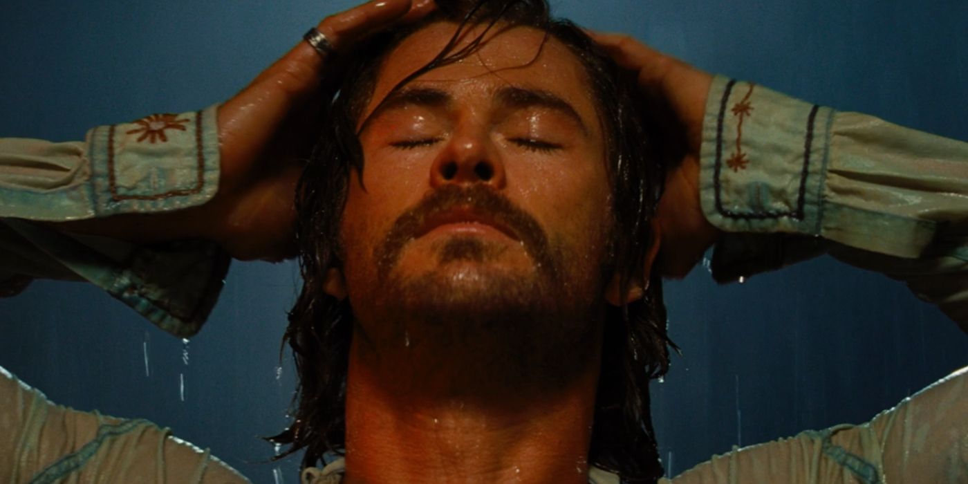 Billy stands in the rain as a cult leader in Bad Times At The El Royale