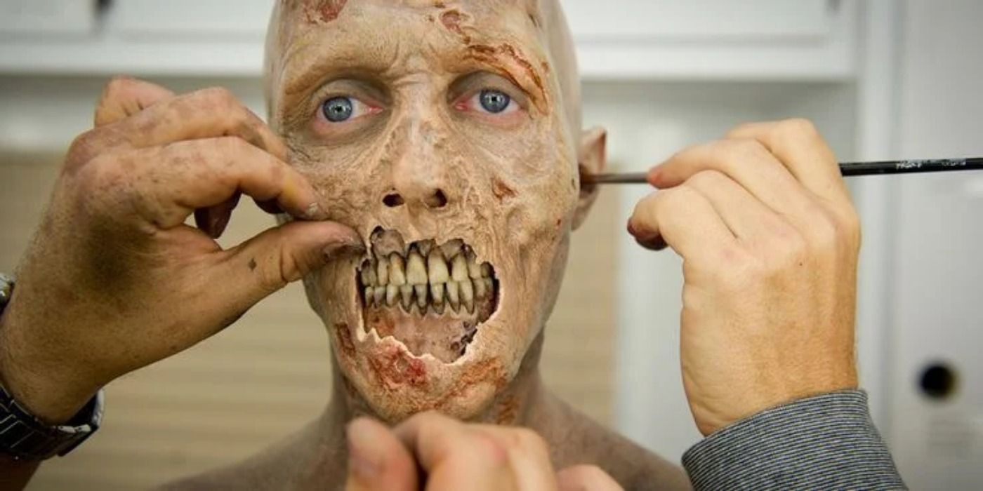 Creating zombie makeup in The Walking Dead.