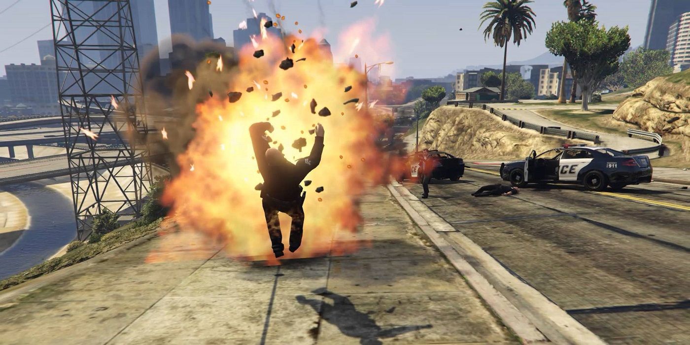 A man falling backwards on the sidewalk during an explosion in the video game Grand Theft Auto V