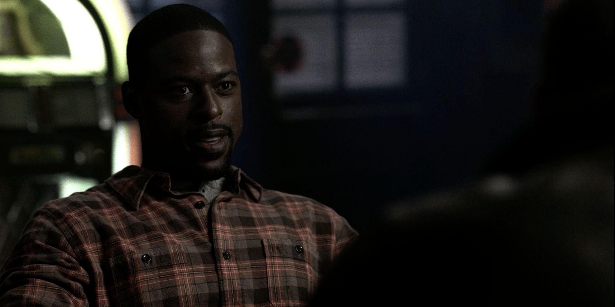 Gordon Walker talks to a shadowy figure in Supernatural.