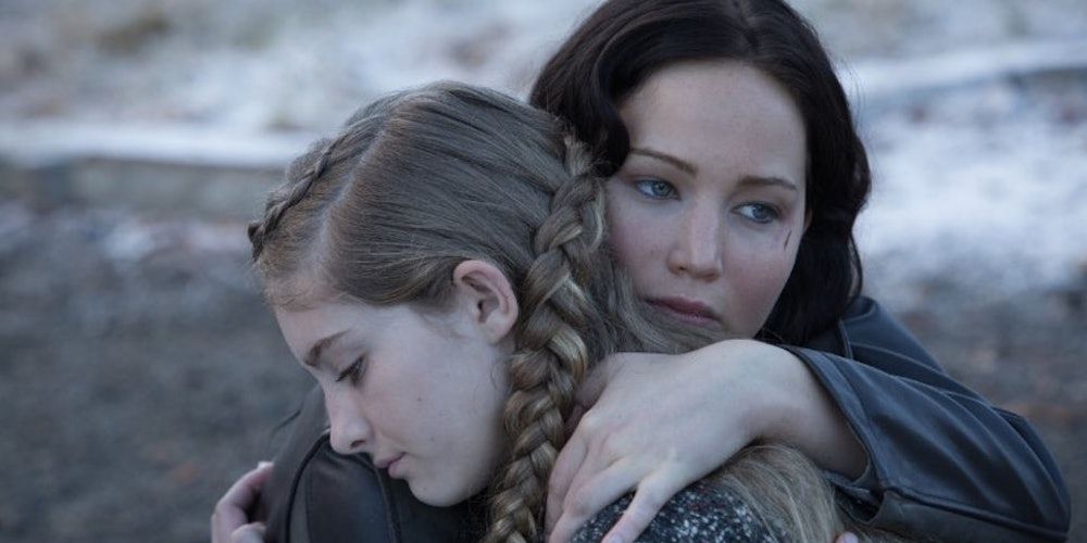 Katniss hugging Prim in The Hunger Games