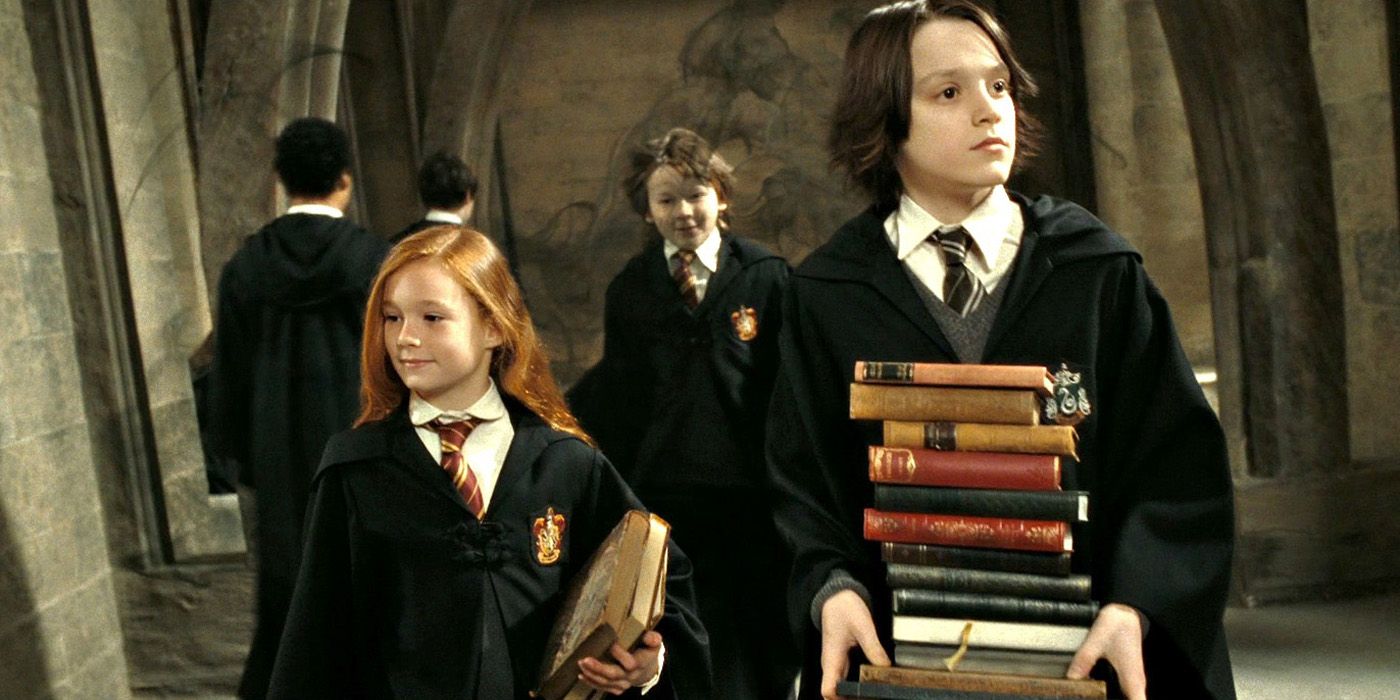 James Potter standing behind Lily and Snape in Harry Potter