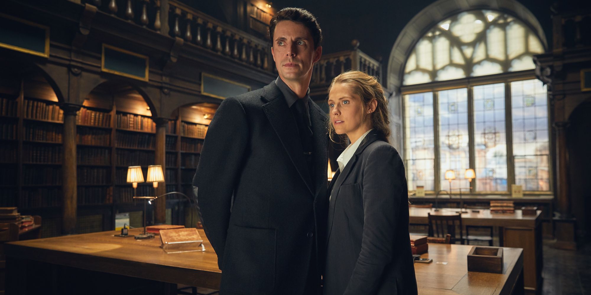 Matthew (Matthew Goode) and Diana (Teresa Palmer) in a library in A Discovery of Witches in A Discovery of Witches