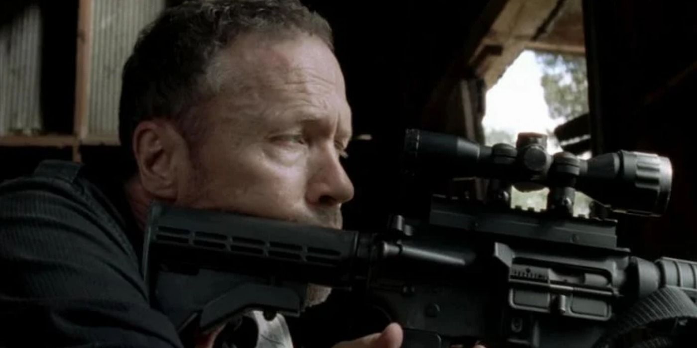 Merle Dixon aiming a gun in The Walking Dead.