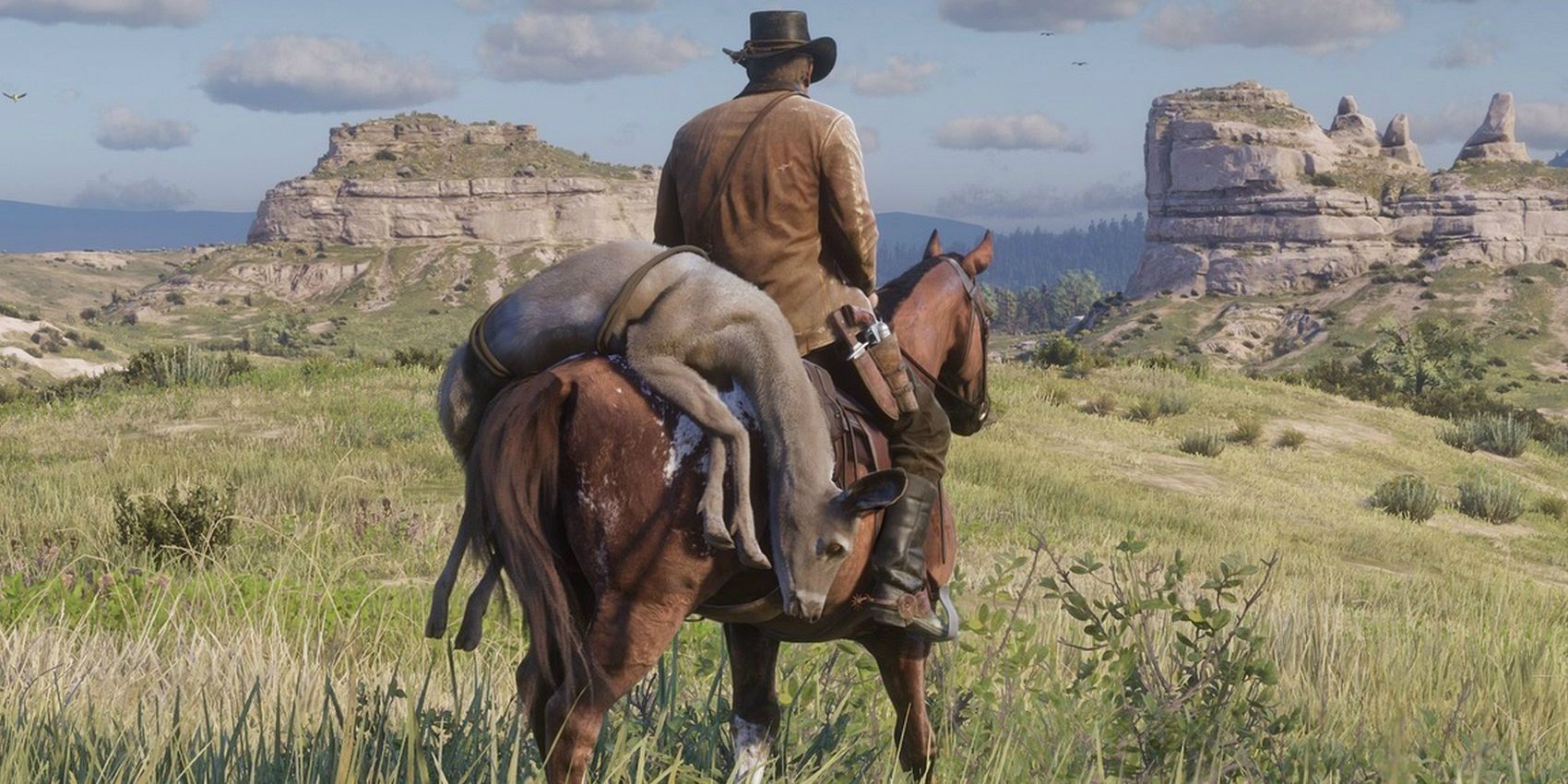 Arthur Morgan rides his horse with an animal pelt on the back after a hunt in Red Dead Redemption 2