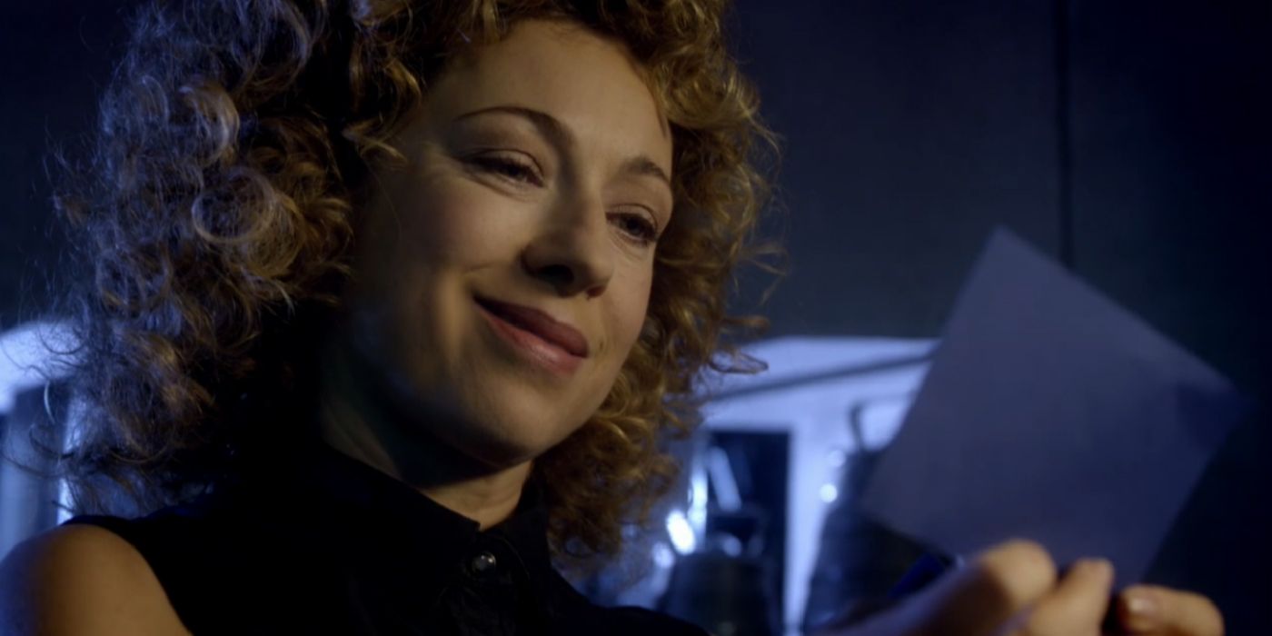 River Song Doctor Who smiling at blue TARDIS card