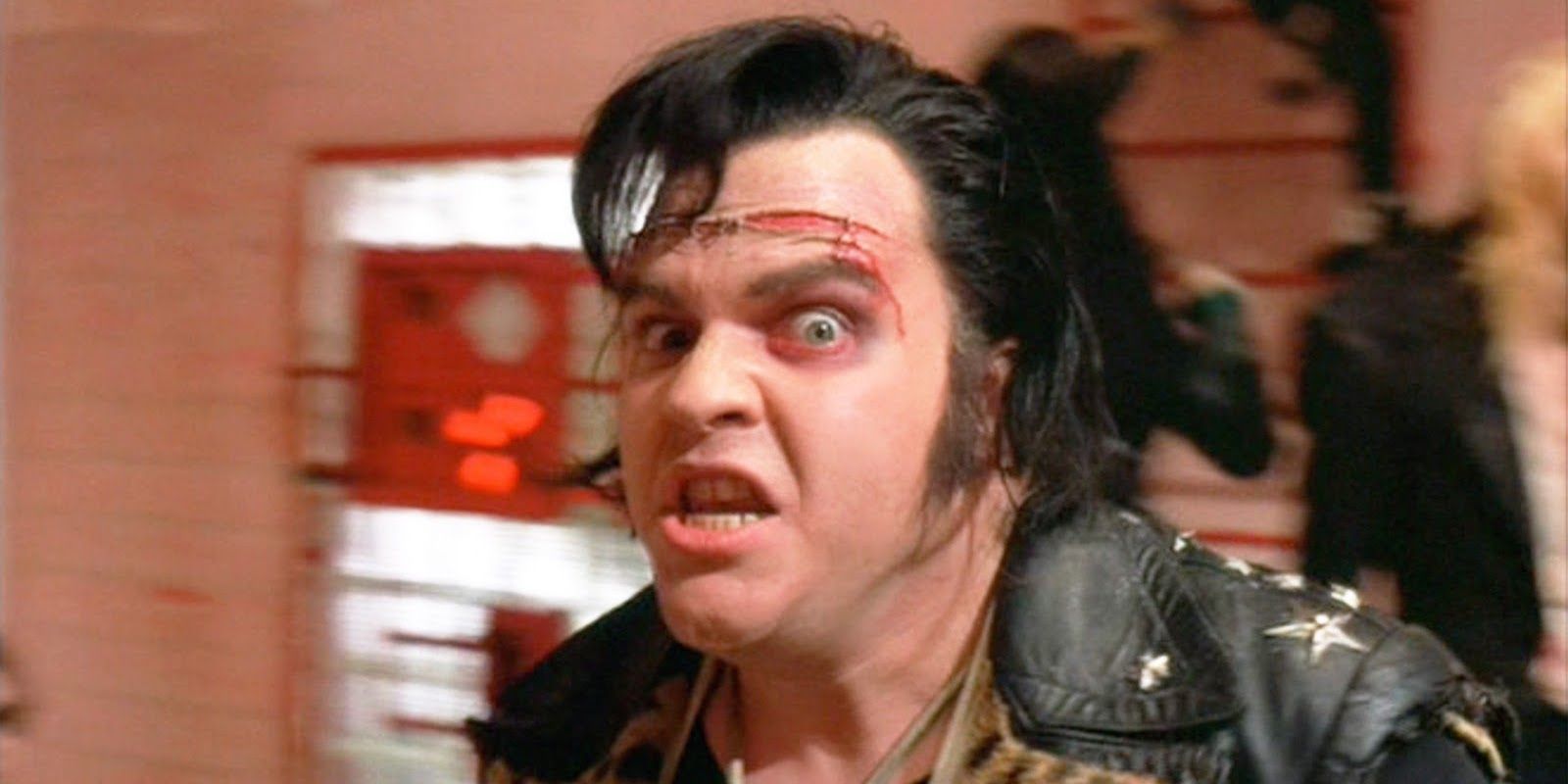 Meat Loaf as Eddie looking angry in Rocky Horror
