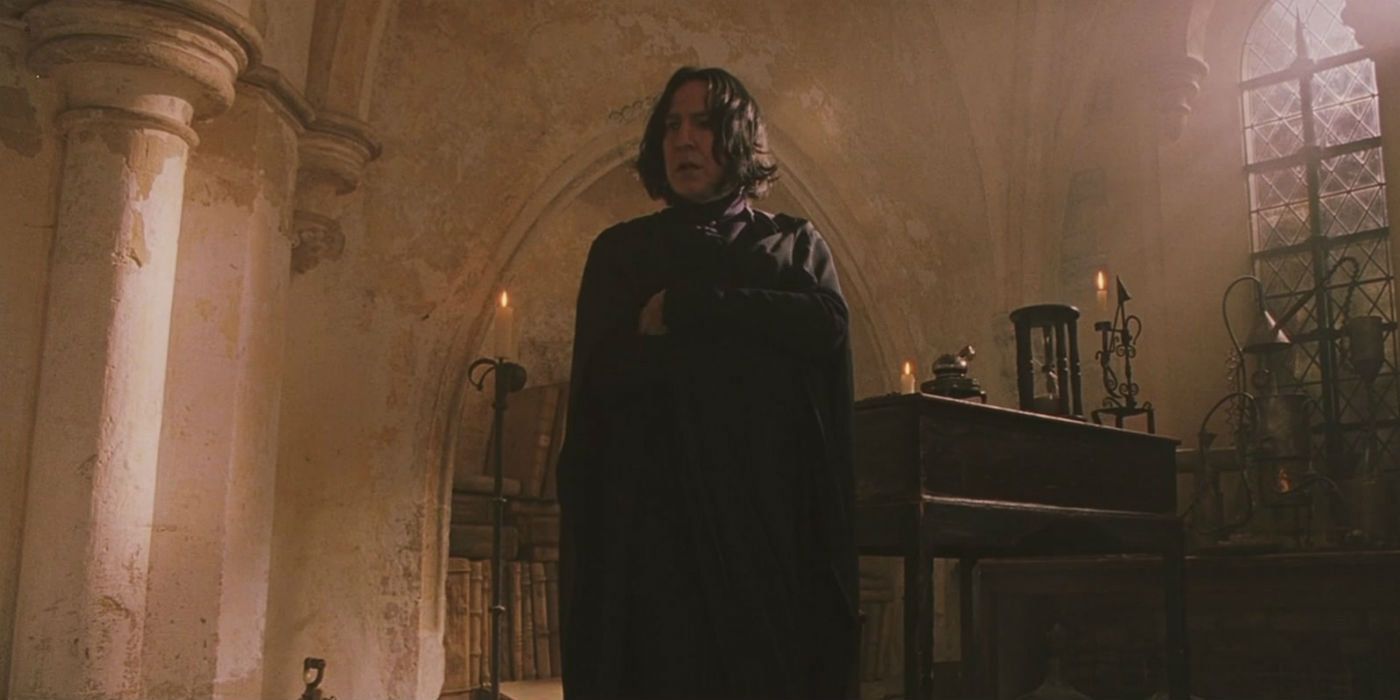 Snape standing alone in a room.