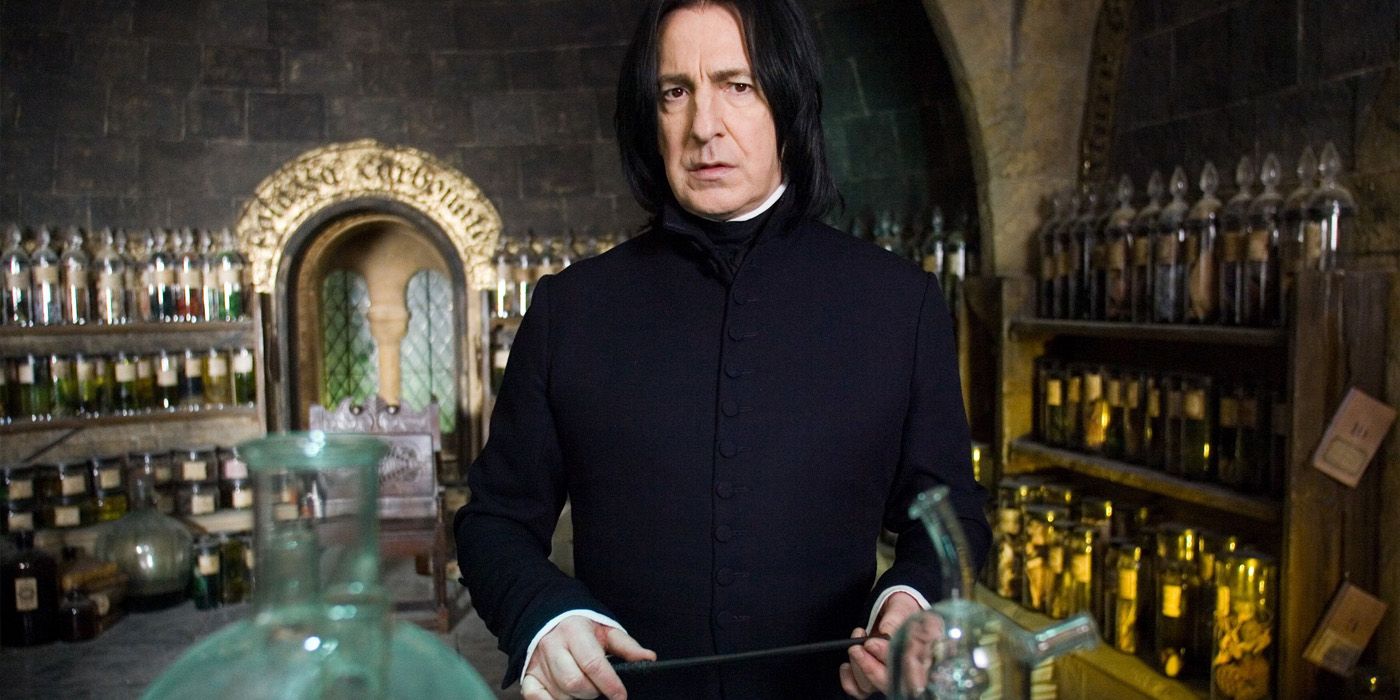 Alan Rickman as Severus Snape holding his wand in a room full of potions
