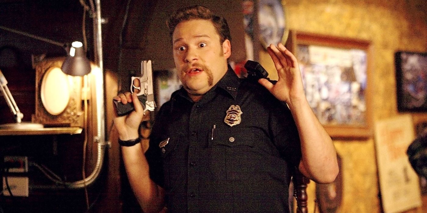 Seth Rogan as a cop holding his hand and gun up in Superbad.