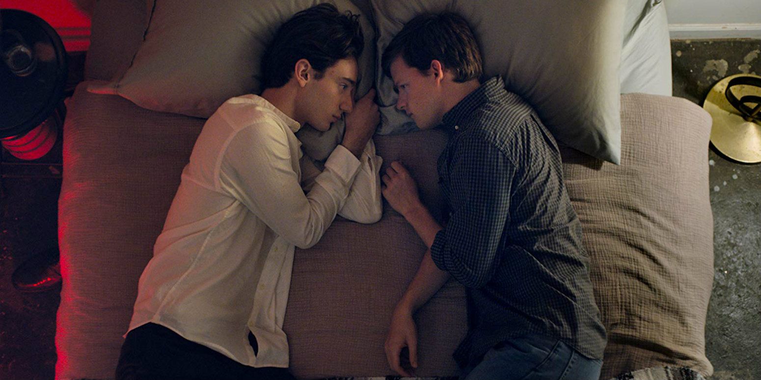 Theodore Pellerin and Lucas Hedges lying in bed in Boy Erased