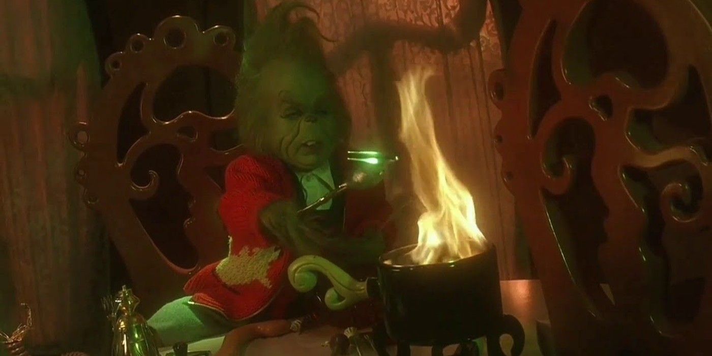Baby Grinch uses fire in a festive outfit