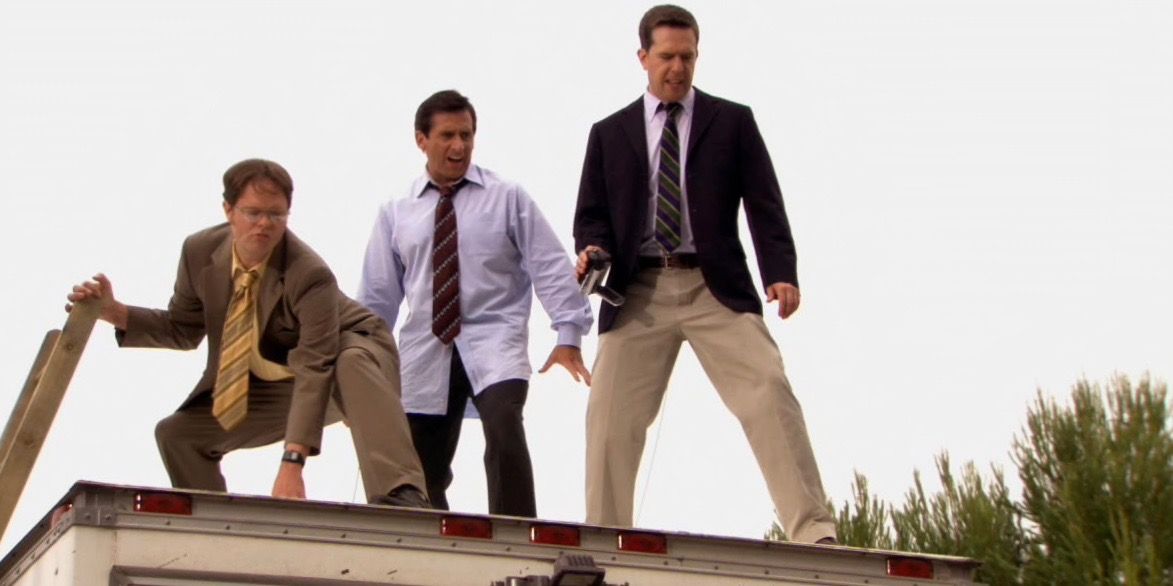 Ed Helms, Steve Carell, and Rainn Wilson as Andy, Michael, and Dwight in The Office